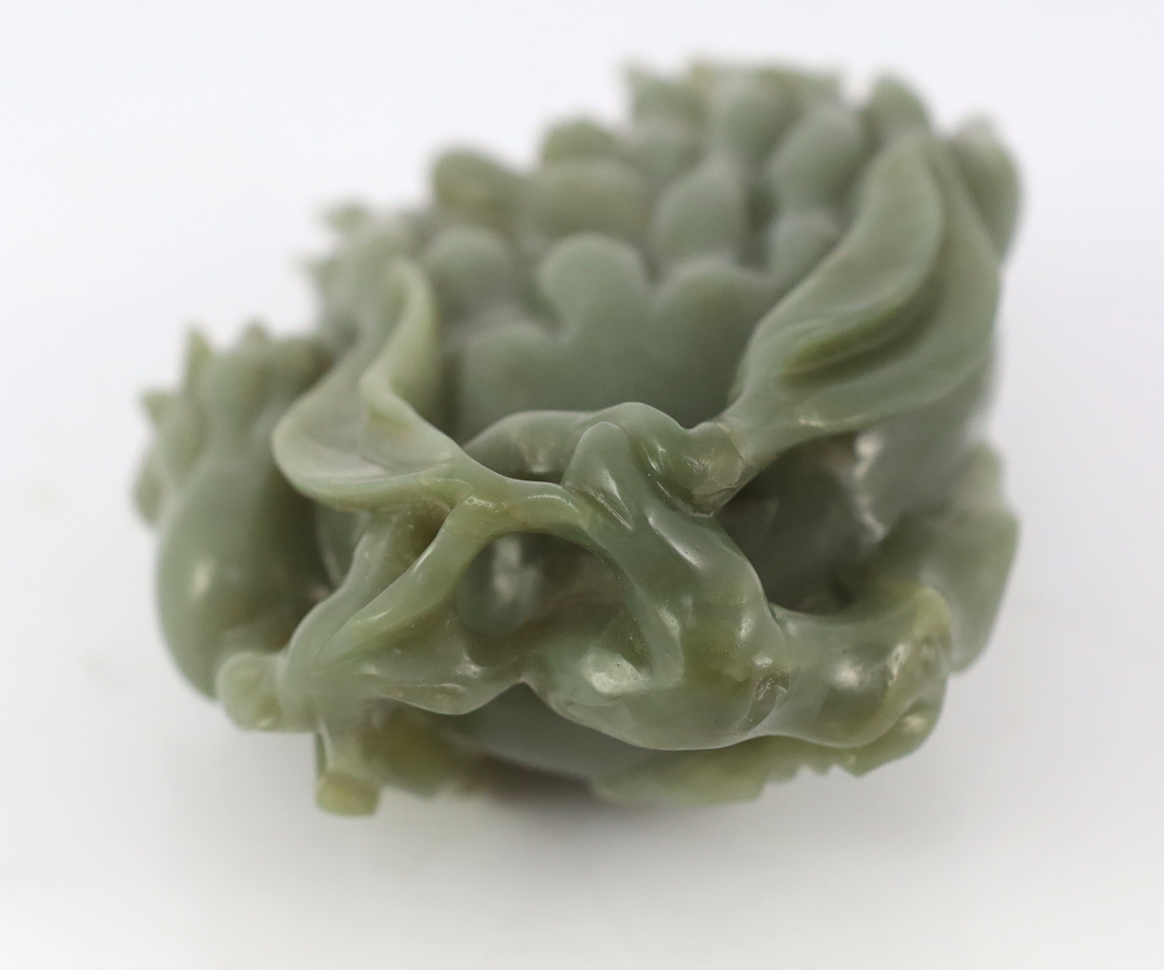 A Chinese celadon jade carving of a finger citron, 20th century